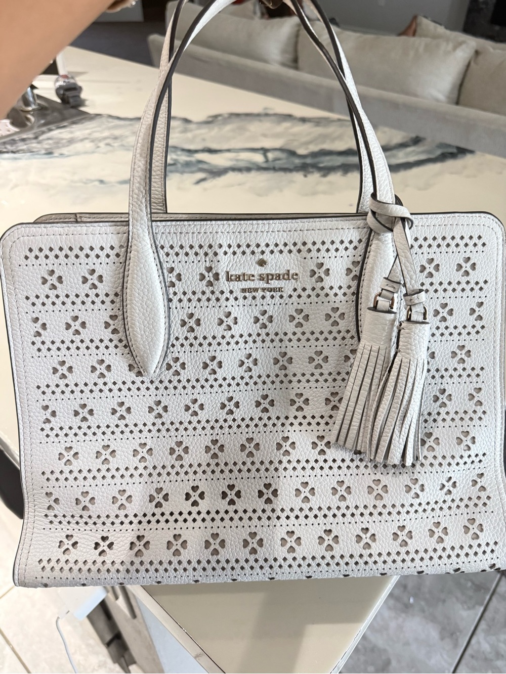 kate spade white perforated leather tote with tassel
